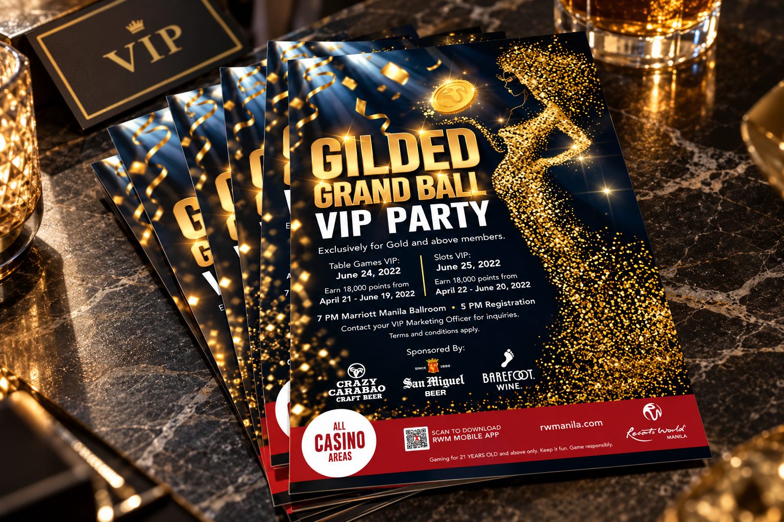 Gilded Grand Ball flyers fanned on a table